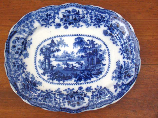 A fine and rare early 19th century Flow Blue serving platter in the "Fairy Villas" pattern by William Adams circa 1830